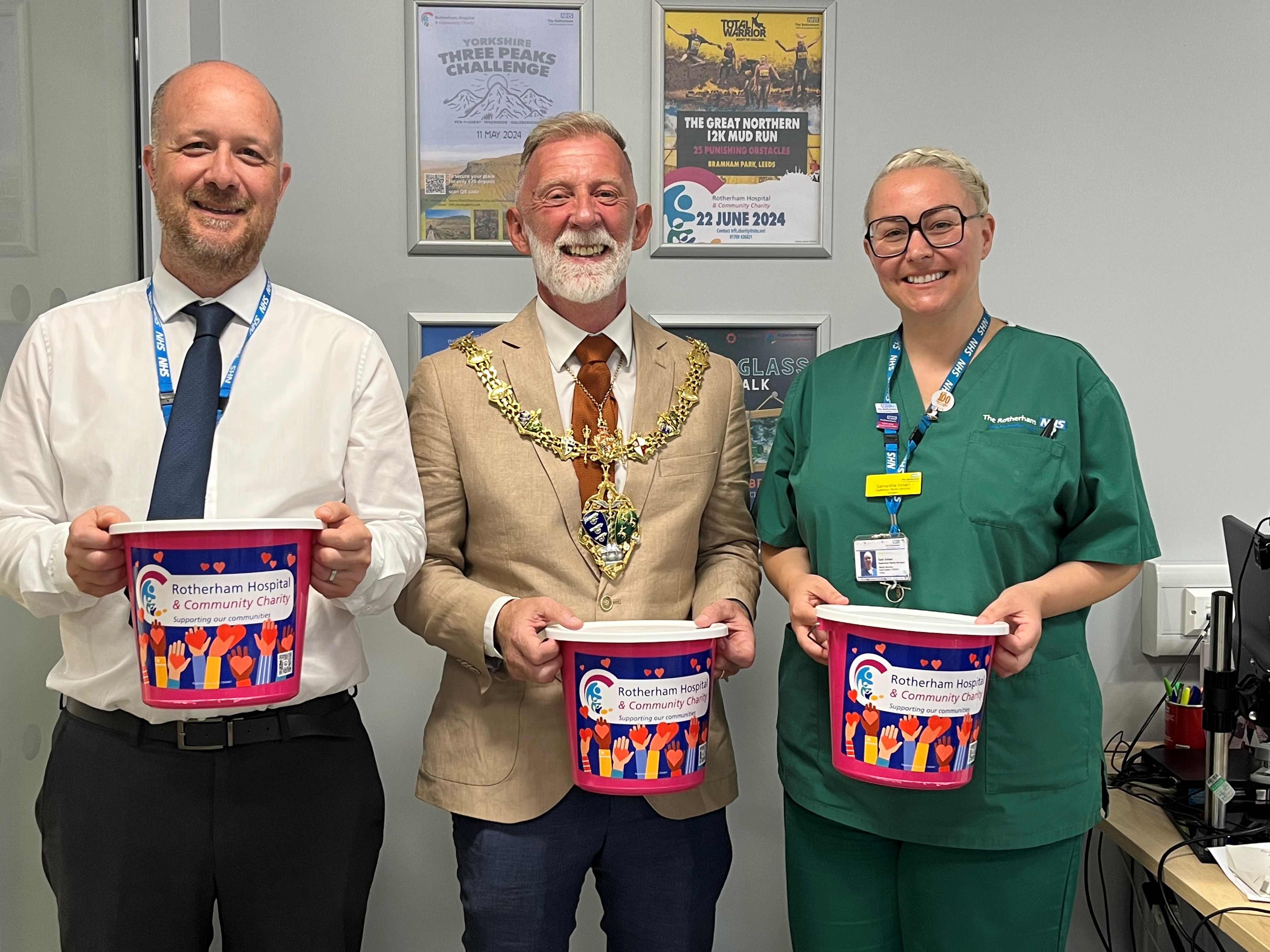 Daniel Hartley, the Mayor of Rotherham and Samantha Inman holding charity collection buckets
