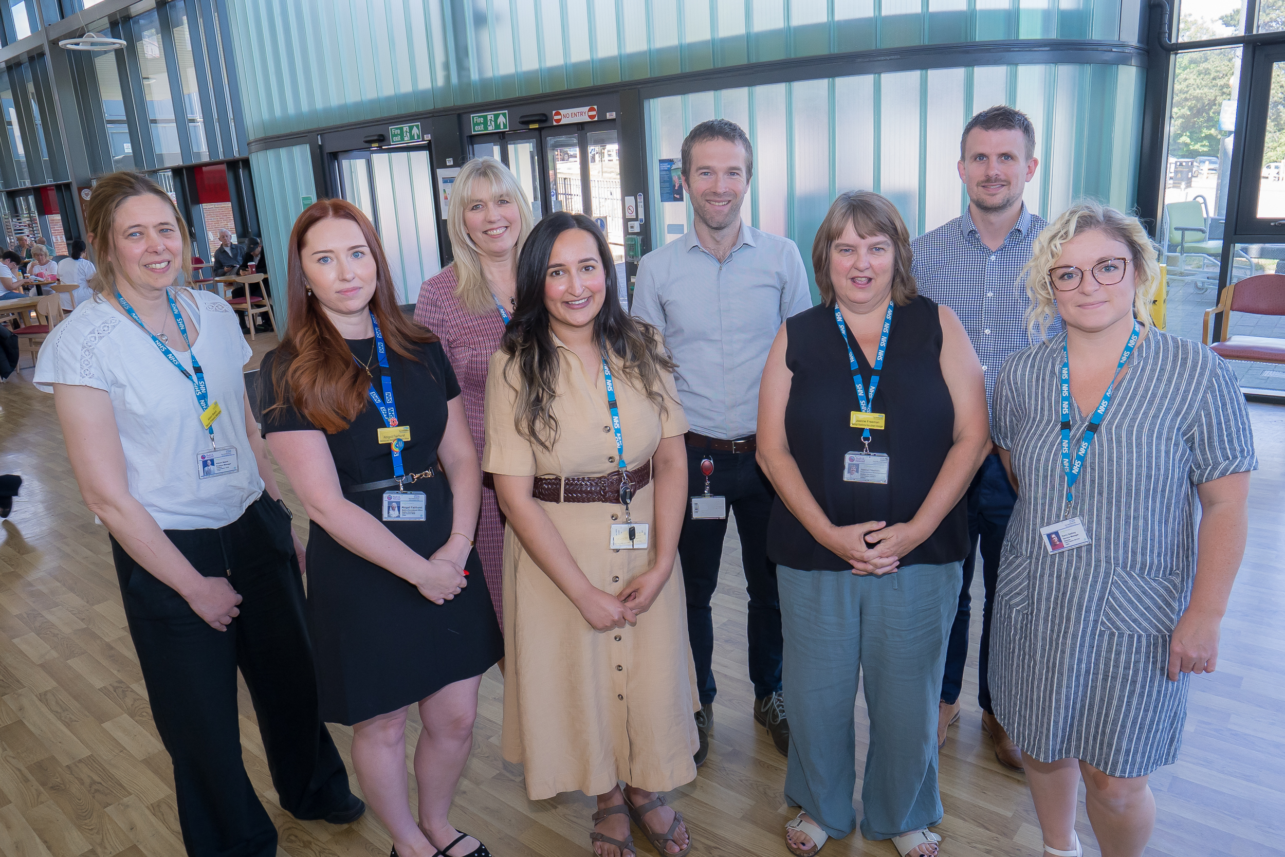 Members of the Medical HR team and Care Group 1 pose in the main entrance of Rotherham Hospital
