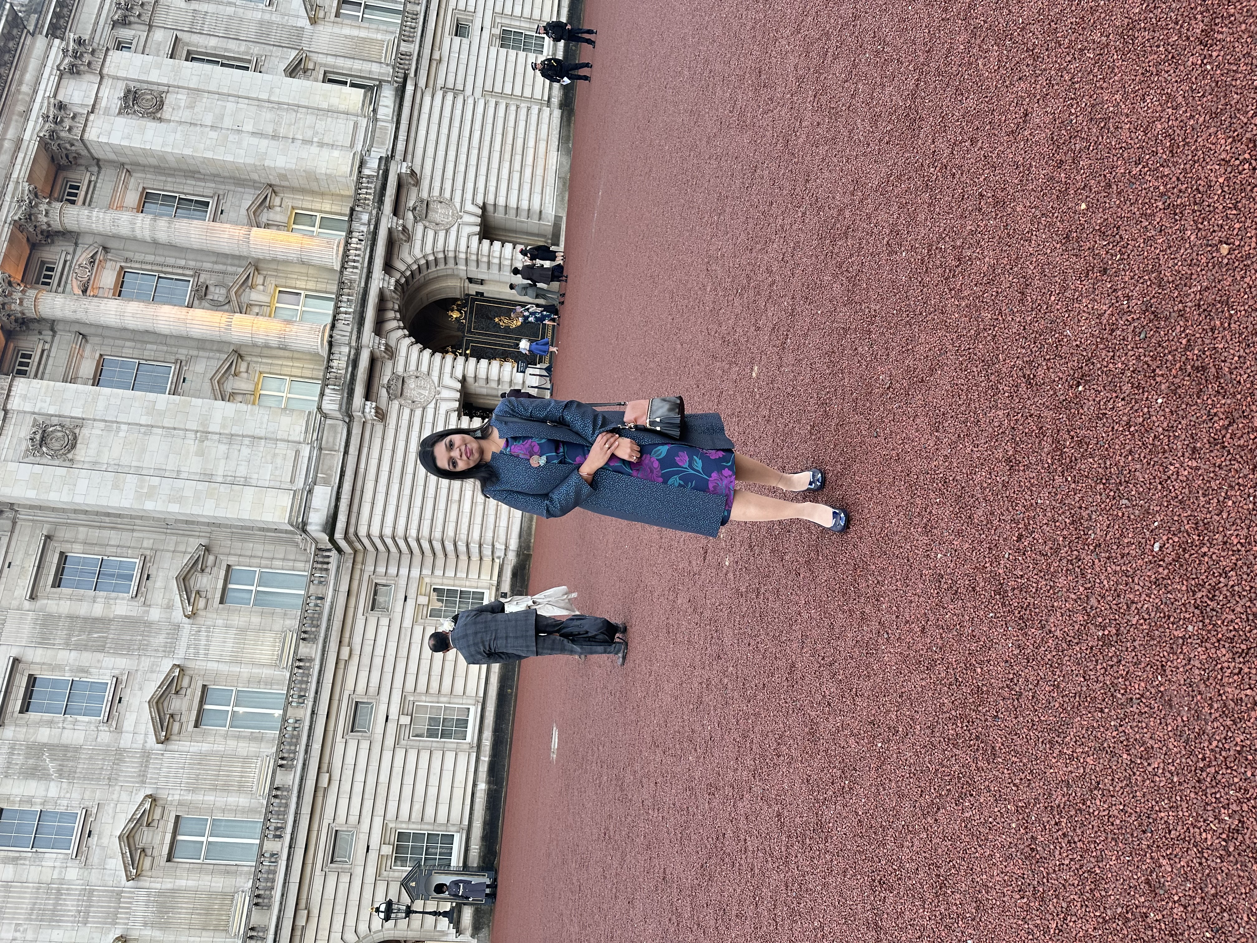 Swapna stood outside Buckingham Palace