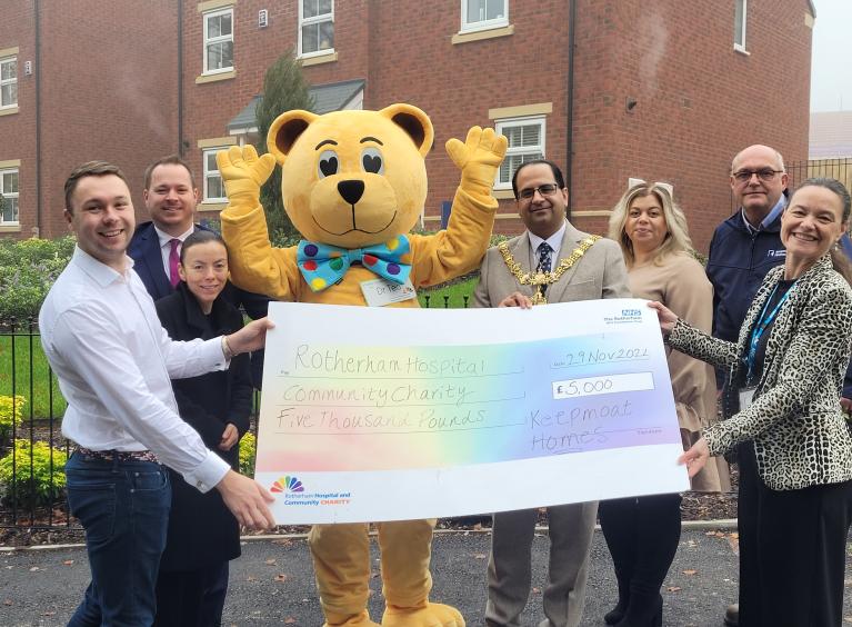A group of staff from Keepmoat presenting a large cheque to the Rotherham Hospital and Community Charity. 