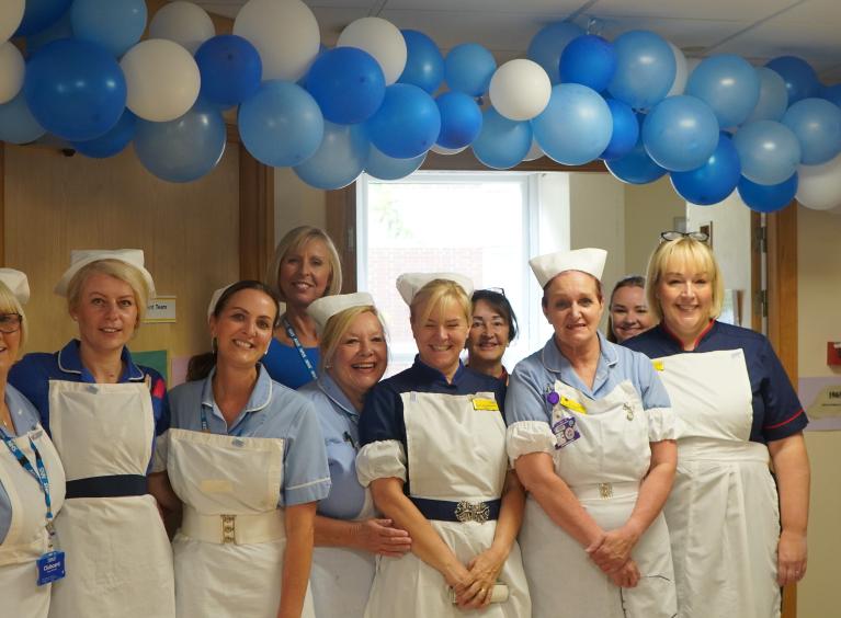 Outpatients team dressed in vintage uniforms