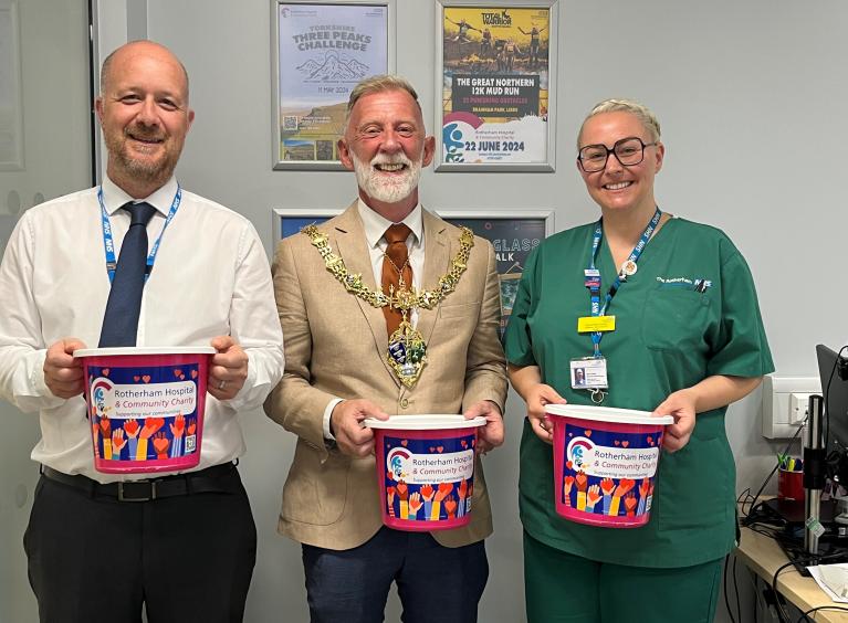 Daniel Hartley, the Mayor of Rotherham and Samantha Inman holding charity collection buckets