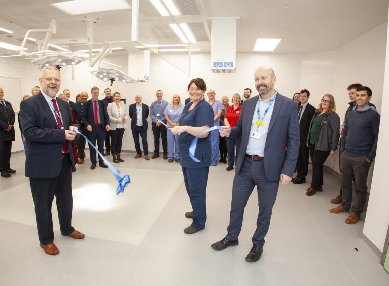 Richard Parker and Dr Richard Jenkins holding a ribbon as it is cut