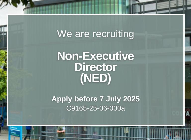 Background image of the front of Rotherham Hospital. There is a grey box in the foreground with the text "We are recruiting Non-Executive Director"