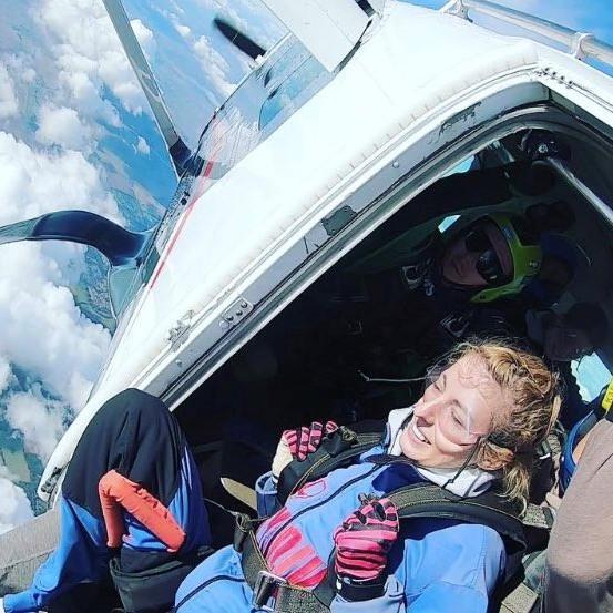 Skydiver about to leap from a plane