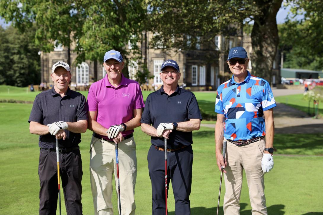 'Team Hallows 2' - four people holding golf clubs and wearing golf attire, stood in front of Rotherham Golf Club