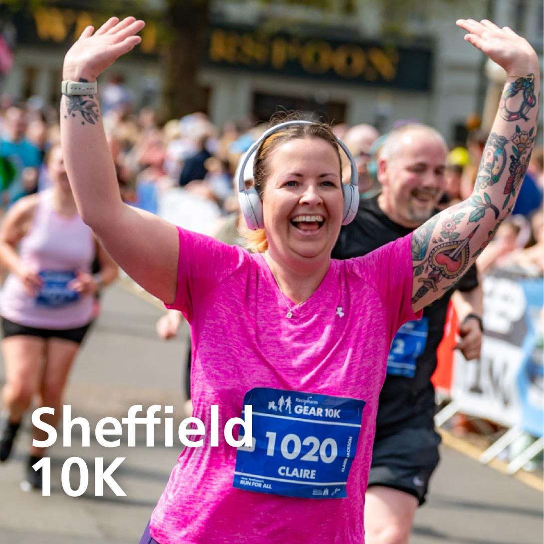 A lady happily runs with her arms in the air! With the words 'Sheffield 10k'