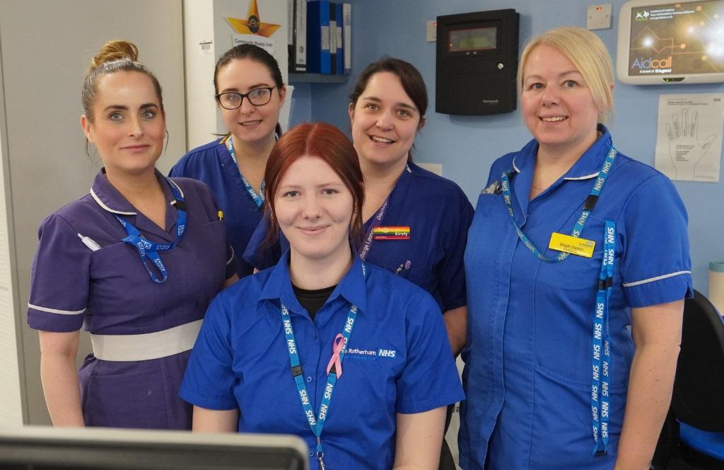 Four members of the Community Ready Unit team in blue and purple uniforms